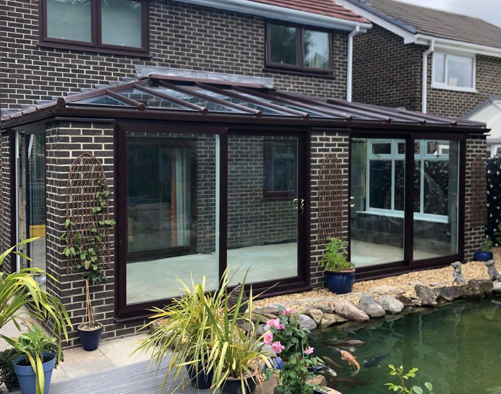 orangery with glass roof and sliding doors